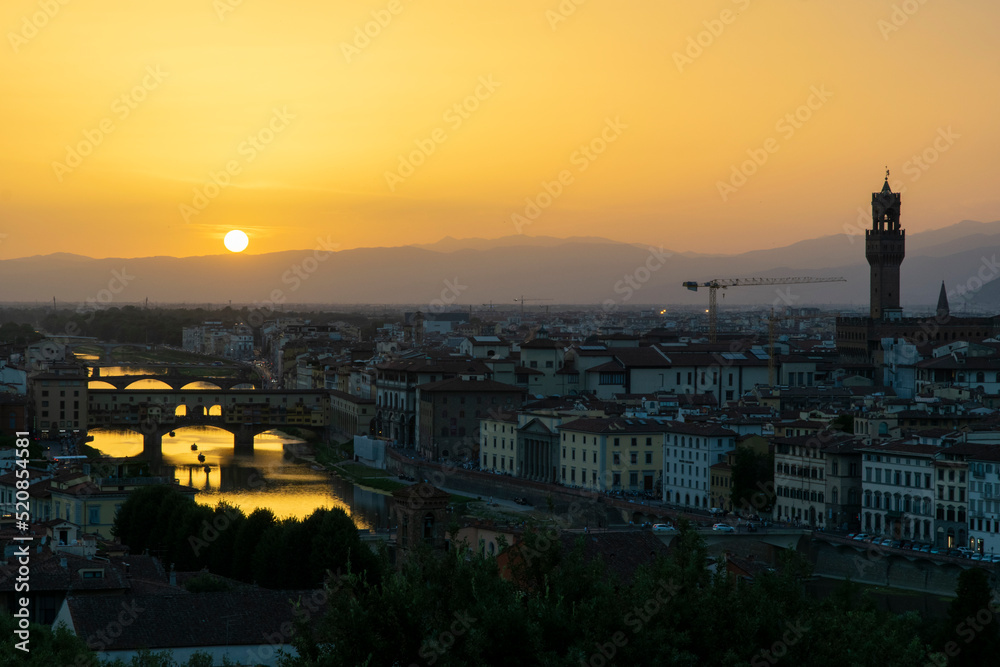 Sunset over the Arno river and Ponte Vecchio, Florence, Italy