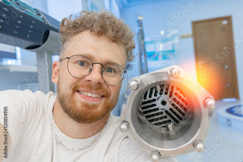 Man student engineer background fragment energy fuel uranium or thorium rod element of nuclear reactor water photo