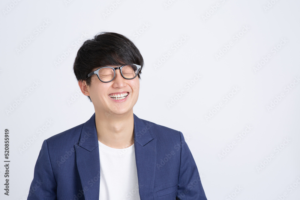 Happy Handsome Asian business man in causal attire with attractive beautiful positive big smiling isolated white background in close up shot
