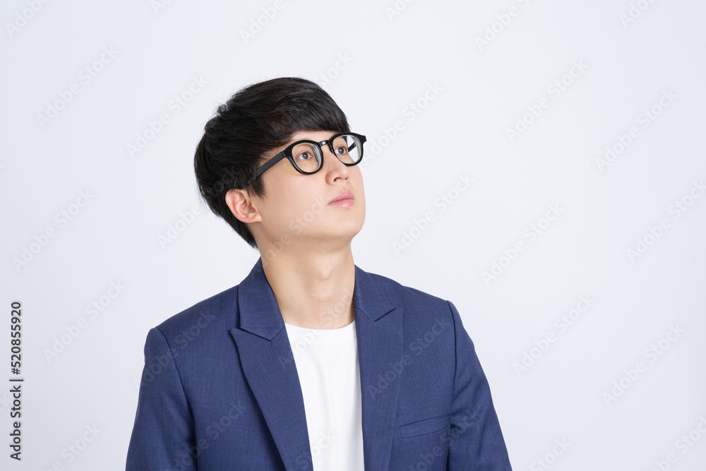 Asian Business man looking up on white background Asian Business man looking up on white background