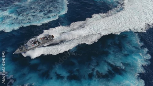 Navy ship in action sailing in Full speed, aerial view
The Idf Dabur is a class of patrol boats built in the United States for the Israeli Navy, 2022, drone view

 photo