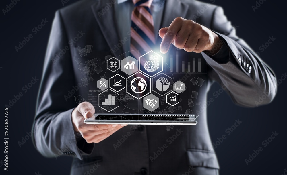 Businessman holding tablet with growing virtual hologram of statistics, graph and chart. Business strategy development and growing growth plan. Investment of growth on currency rate. Businessman holding tablet with growing virtual hologram of statistics, graph and chart. Business strategy development and growing growth plan. Investment of growth on currency rate.