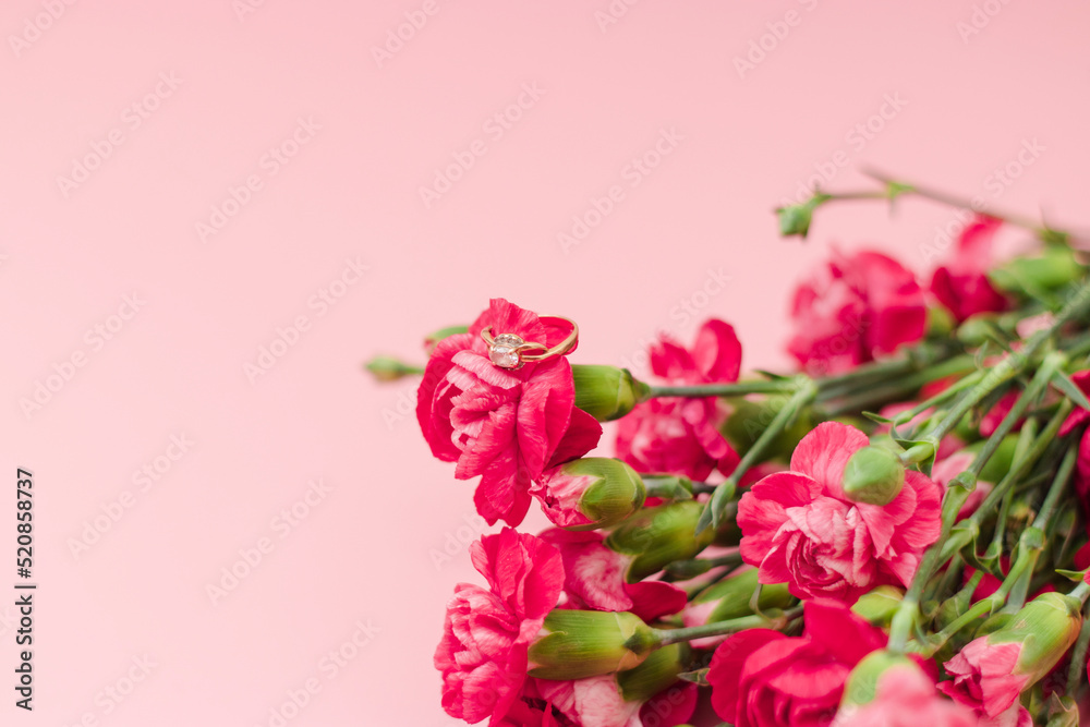 Red mini carnation and gift box. Concept of giving present at mother's day as surprise, flat lay, top view On pink Background Red mini carnation and gift box. Concept of giving present at mother's day as surprise, flat lay, top view On pink Background