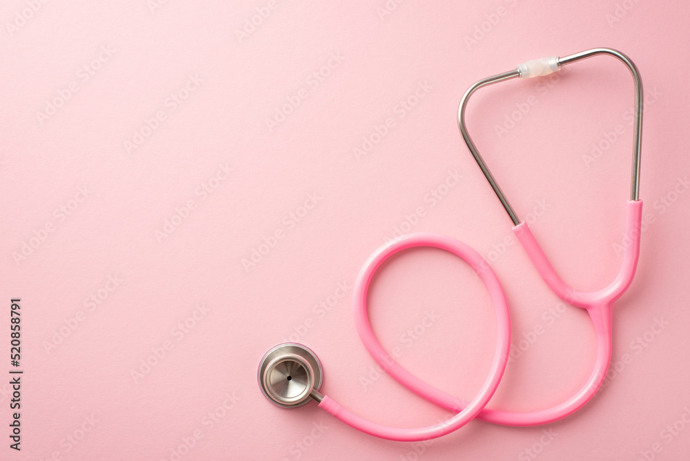 Breast cancer prevention concept. Top view photo of pink stethoscope on isolated pastel pink background with empty space Breast cancer prevention concept. Top view photo of pink stethoscope on isolated pastel pink background with empty space