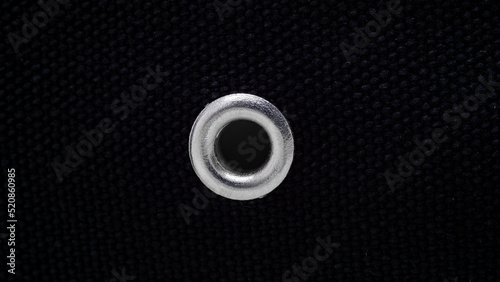 metal rivet, eyelet on black canvas fabric photo