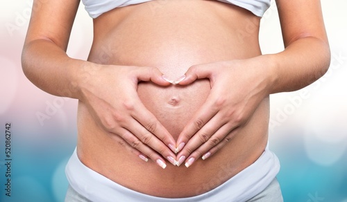 Wallpaper Mural Young healthy woman hand made heart shape on her stomach. Concept of good digestive, healthy gut, probiotics, slim fit, gynecology and woman health care. Torontodigital.ca