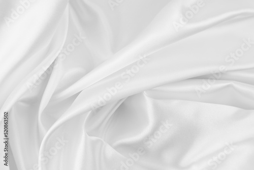 Rippled white silk fabric texture background 