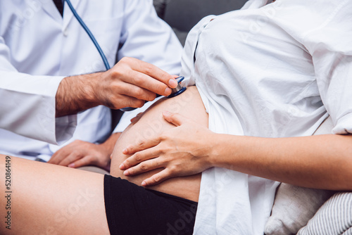 Doctor are Checking Pregnant Woman with Stethoscope in the Hospital - Healthcare Concept