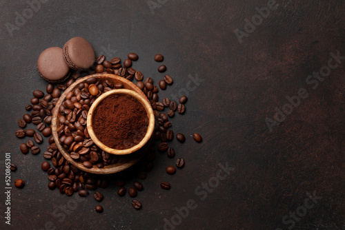Ground coffee, roasted coffee beans and macaroons