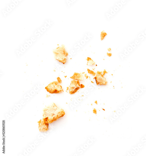 Dried crispy crumbs of white bread isolated on white photo