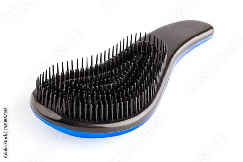 New hair comb  density on a white background. Accessory for personal care. Close-up