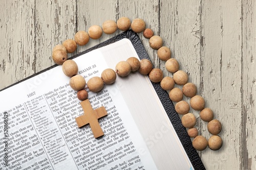 A holy book open on a blurry stand inspired image. photo