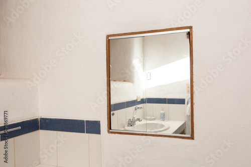 View of a rural bathroom. White room for hygiene in rural house. Bathroom in family home.