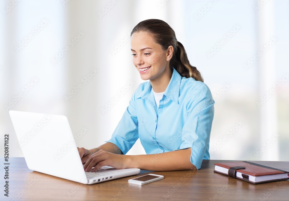 Happy Business Lady Using Laptop Posing Sitting At Workplace In Modern Office. Successful Entrepreneurship And Career Concept Happy Business Lady Using Laptop Posing Sitting At Workplace In Modern Office. Successful Entrepreneurship And Career Concept