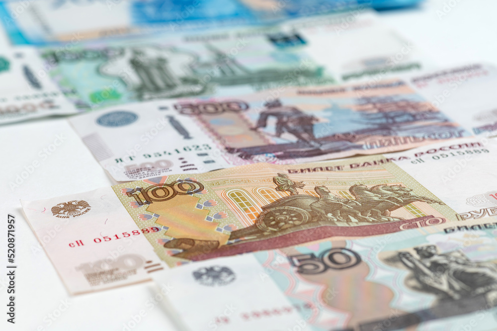 Russian rubles background. Money background and texture. Banknotes of different denominations Russian rubles background. Money background and texture. Banknotes of different denominations