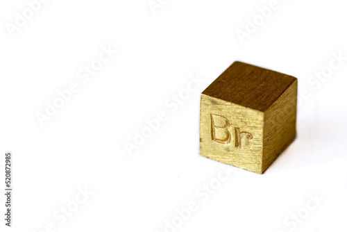 Brass cube with alloy name Br on it on white background