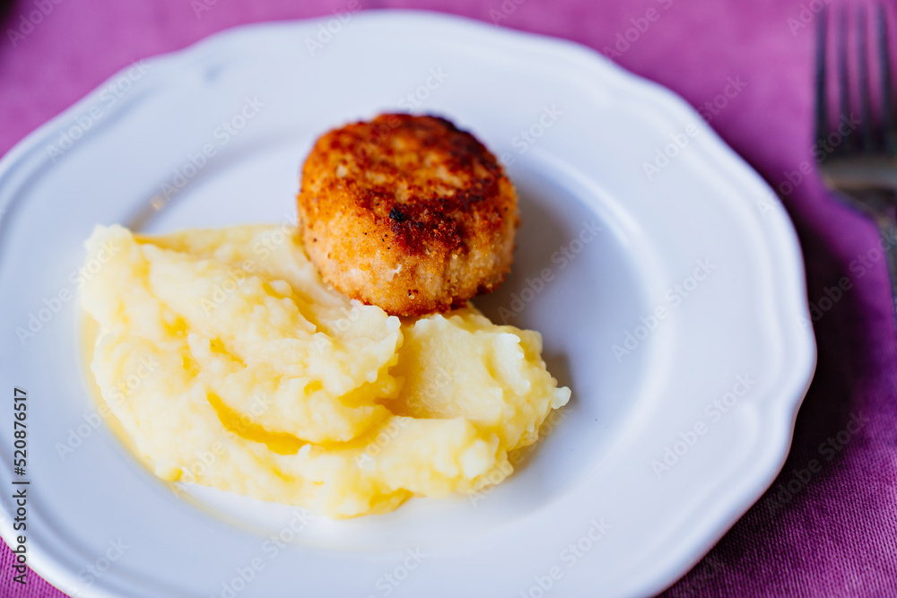 plate with mashed potatoes and cutlets. children's menu.