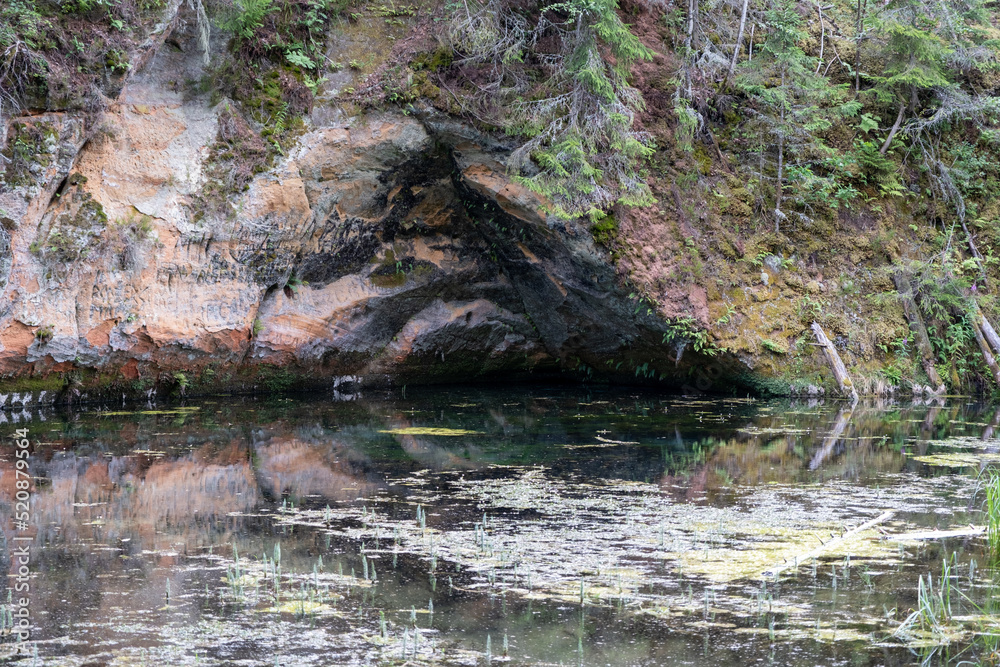 Mirror cliffs and an old river channel in a very beautiful forest in Cirulu nature trails, Latvia.