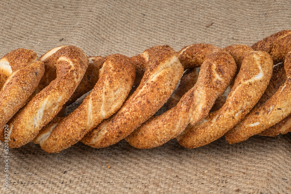 Turkish Bagel Simit with sesame, traditional pastry of Turkey.Traditional street food for Turkey , Turkish names ' simit or gevrek'. Turkish Bagel Simit with sesame, traditional pastry of Turkey.Traditional street food for Turkey , Turkish names ' simit or gevrek'.