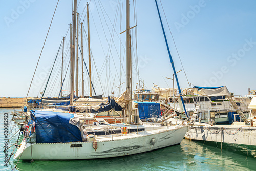 yachts and fishing boats on the pier at the marina