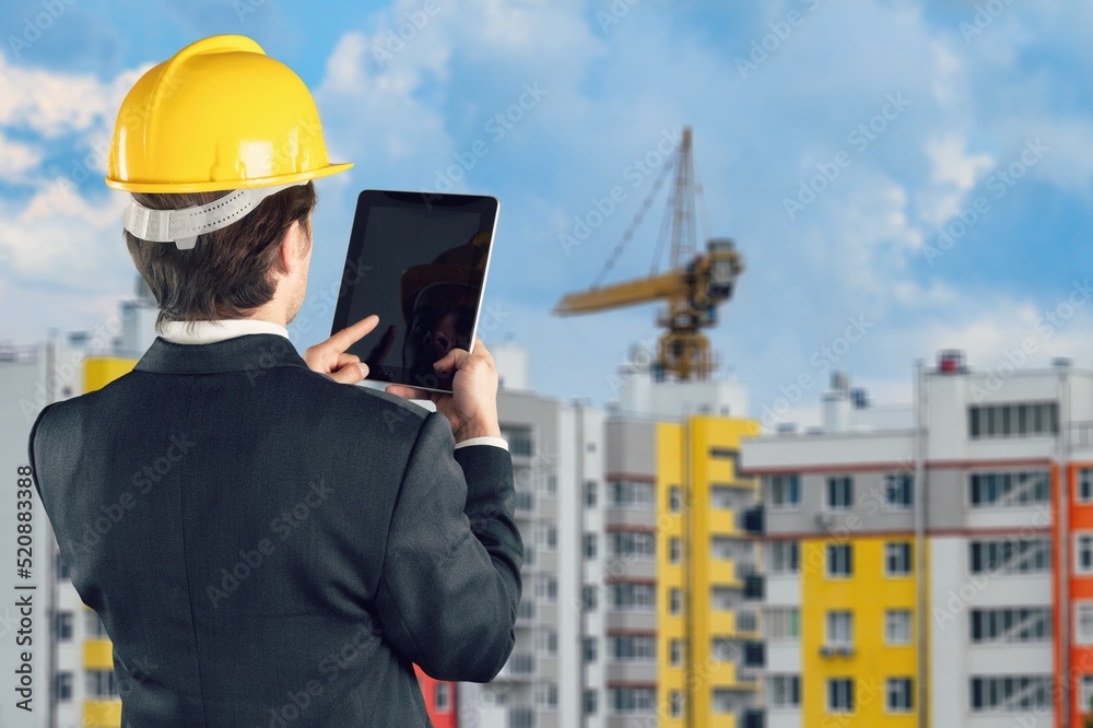 Engineer under checking the industry cooling tower air conditioner of large industrial building to control air system. Engineer under checking the industry cooling tower air conditioner of large industrial building to control air system.