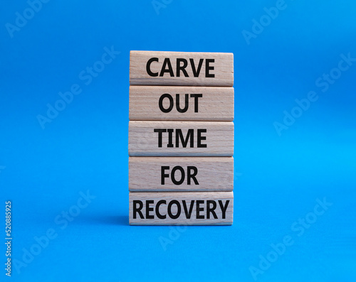 Carve out time for recovery symbol. Wooden blocks with words Carve out time for recoveryg. Beautiful blue background. Business and Carve out time for recovery concept. Copy space.