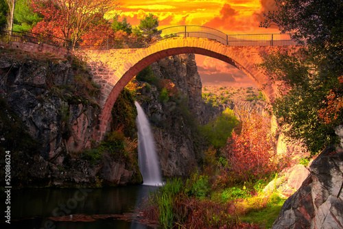 Valokuvatapetti Clandras bridge and Clandras waterfall, where history and nature meet