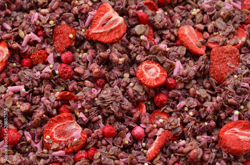 food background pink muesli with strawberry flavor with freeze-dried berries photo