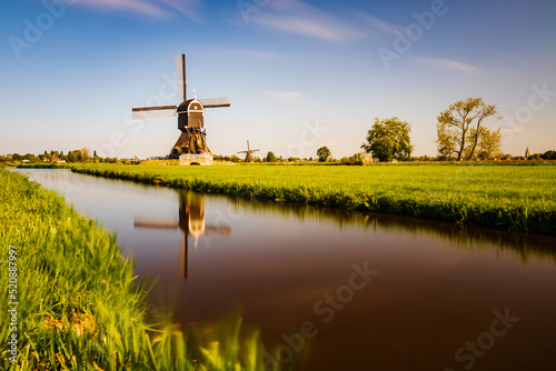 Old windmill with a paddle wheel in the east in the Netherlands in the Kinderdiijk area. In 1989, the mill was thoroughly renovated and ready for grinding again. © Petr