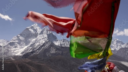 prayer flags in high wind in nepal mountains mount everest base camp trek