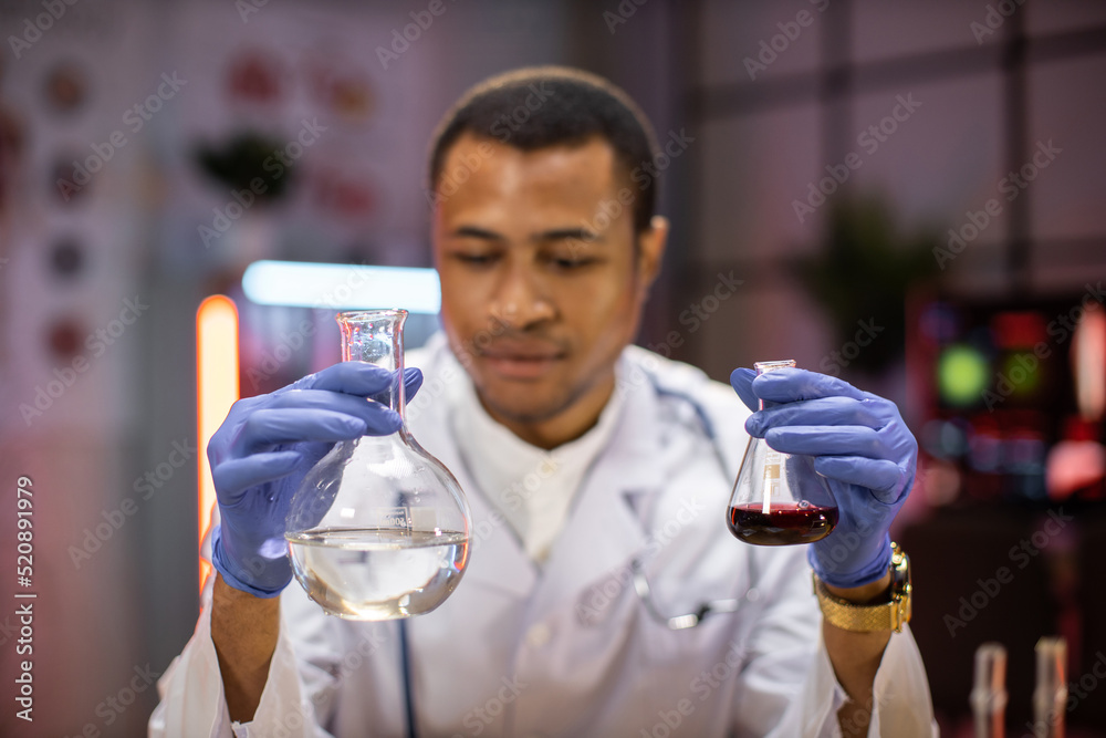 Male scientist working in modern lab. Doctor making microbiology ...