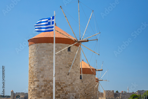 Windmills of Mandraki harbour in Rhodes town, Greece, Europe.