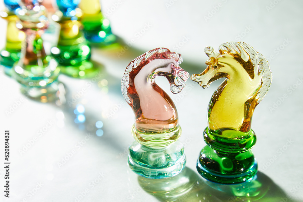 Glass chess is on a glass surface. High quality photo Glass chess is on a glass surface. High quality photo