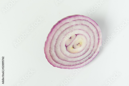 Top view of sliced fresh onion on white background