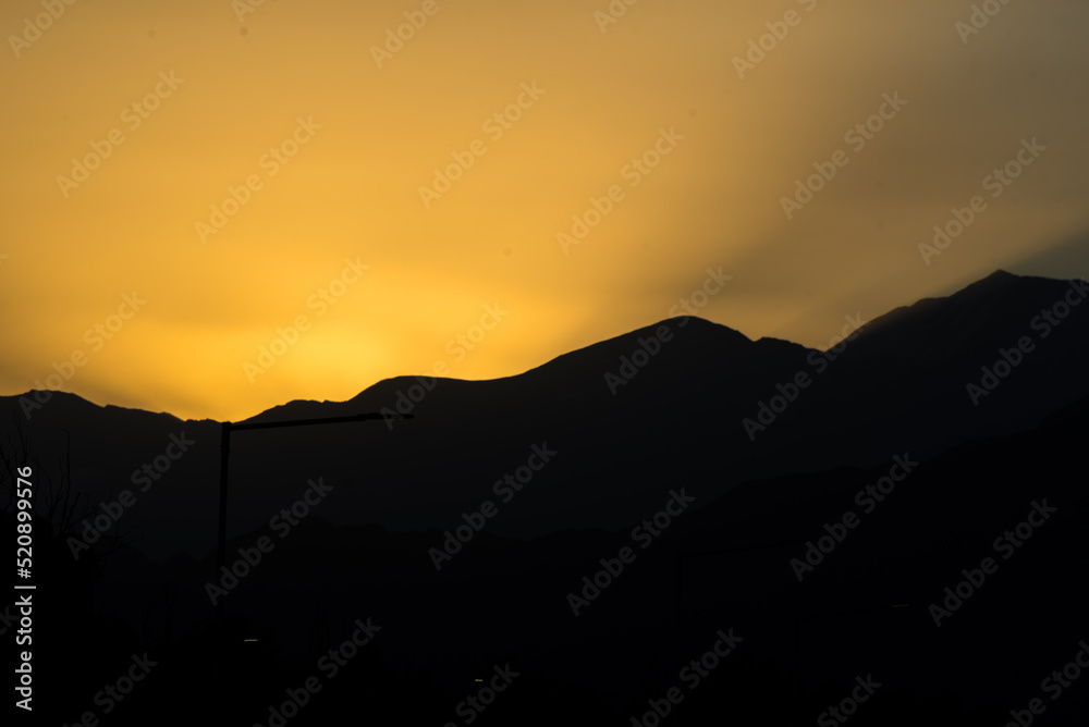 landscape in the shadows of a sunset, clear sky