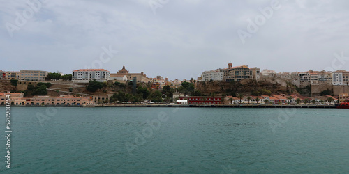 Mahon (Mao), Minorca (Menorca), Spain. Port of Mahon - the largest natural port in the Mediterranean Sea. Small islands, fortifications, villas, boats make beautiful scenery. View from the cruise boat