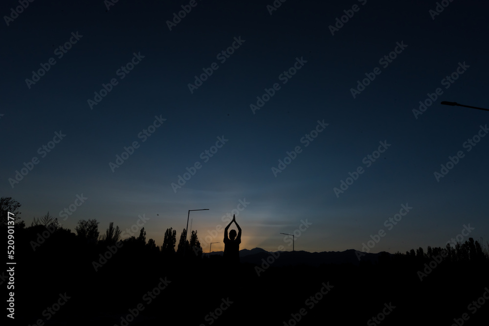 woman exercising outdoors under the night