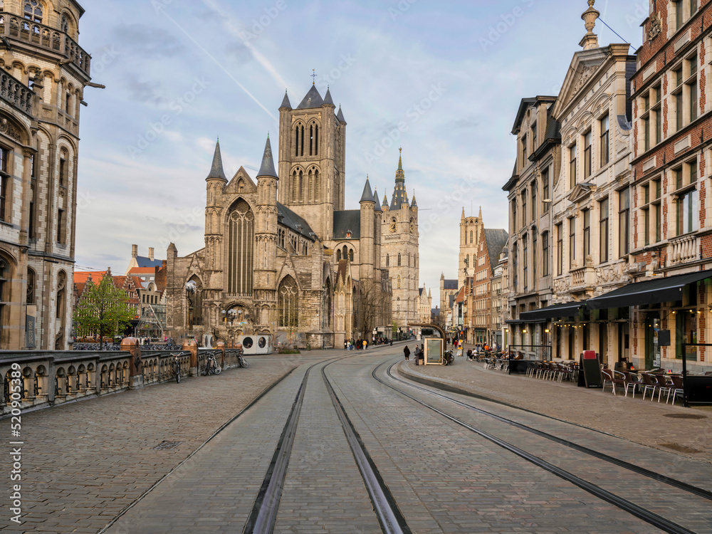 Cobble Stones Sint-Michielsplein street and historic medieval building in Ghent, Belgium