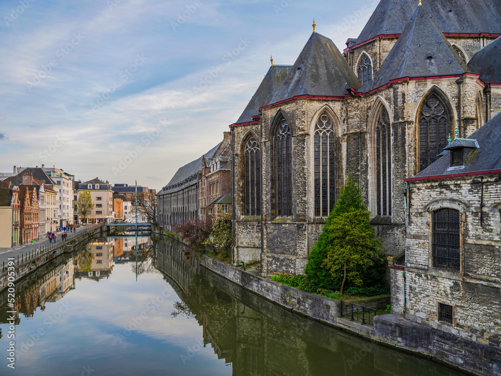 Historic medieval building on Leie riveron a summer day in Ghent, Belgium Historic medieval building on Leie riveron a summer day in Ghent, Belgium