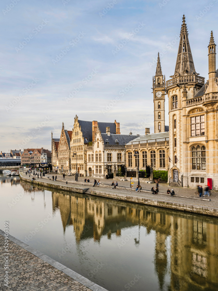 Historic medieval buildings and their reflection on Leie river in Ghent, Belgium