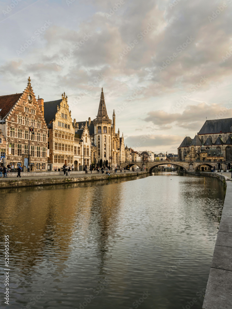 Historic medieval building and on Leie river in Ghent, Belgium