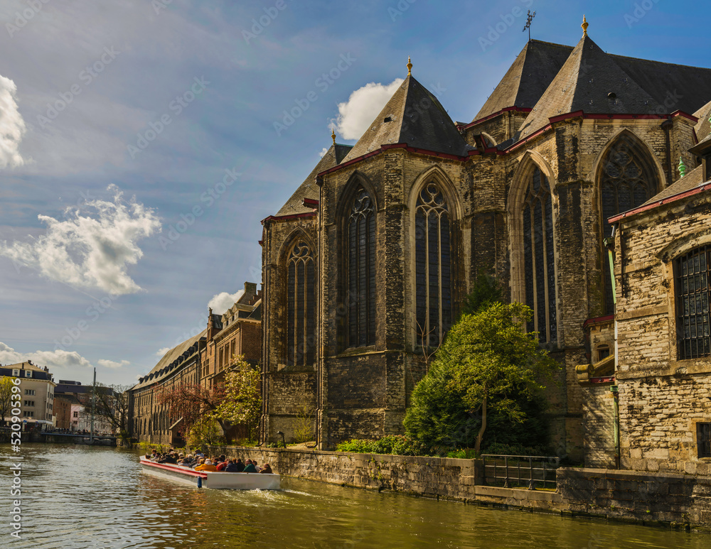 Naklejka premium Historic medieval buildings and on Leie river in Ghent, Belgium