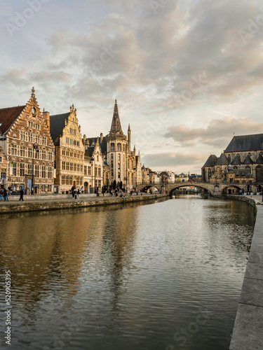 Historic medieval building and on Leie river in Ghent, Belgium