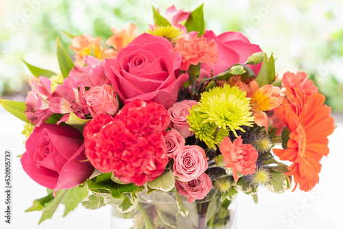 Close up of beautiful fresh centerpiece of a variety of colorful flowers.