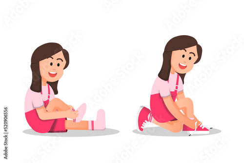 little girl wearing socks and tying her shoelaces