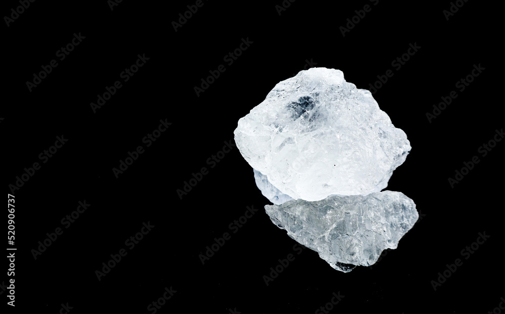 Isolated clear alum cubes on dark background concept for spa and body deodorant industrial Isolated clear alum cubes on dark background concept for spa and body deodorant industrial