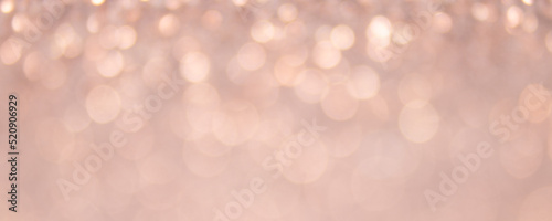 Abstract blurred brown background with circular brown and white bokeh. Blur Image of an autumn forest in evening sunset. Beautiful wallpaper, vintage tone.