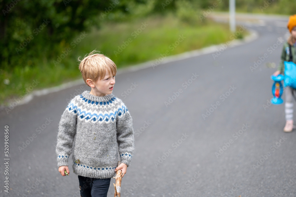 little child playing on the road little child playing on the road