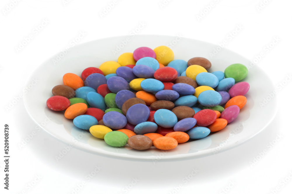 Multi coloured halloween candy sweets on a plate Multi coloured halloween candy sweets on a plate