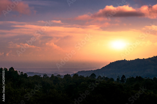 sunset with forest viewed from the peak